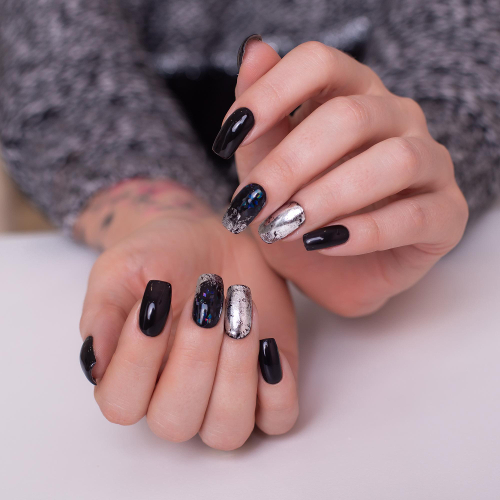 beautiful-female-hands-with-fashion-manicure-nails-black-gel-polish